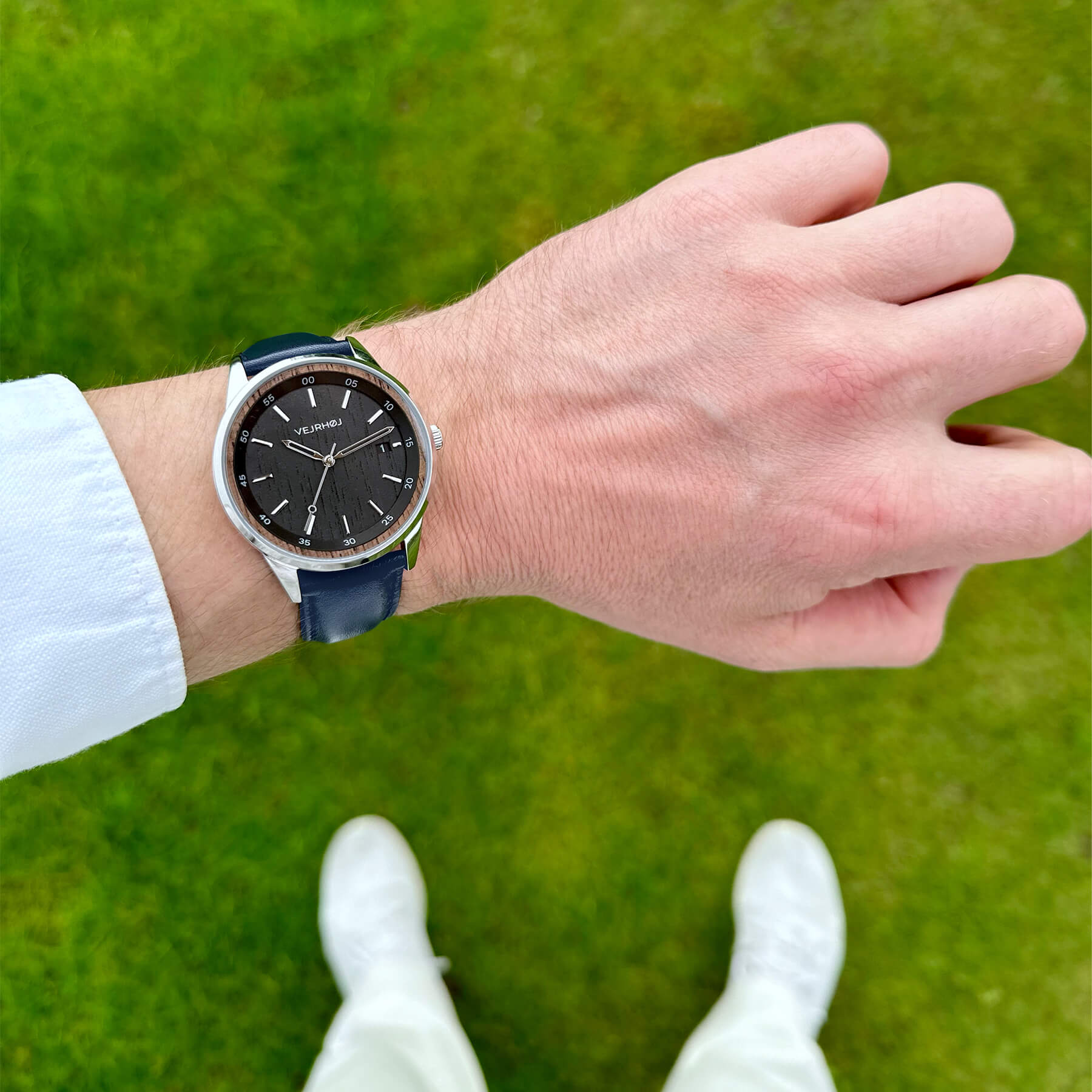 Black automatic watch with blue leather strap