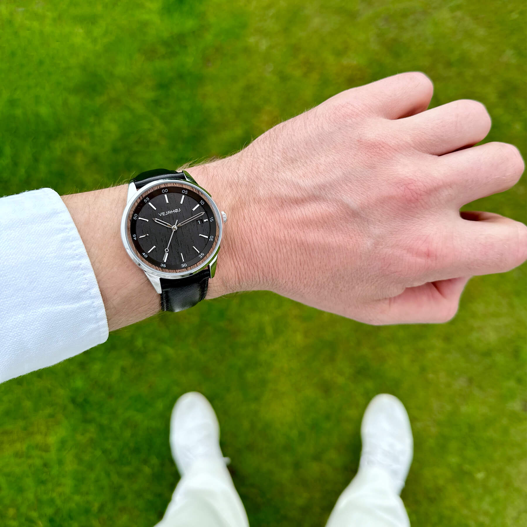 black automatic VEJRHØJ watch on the wrist