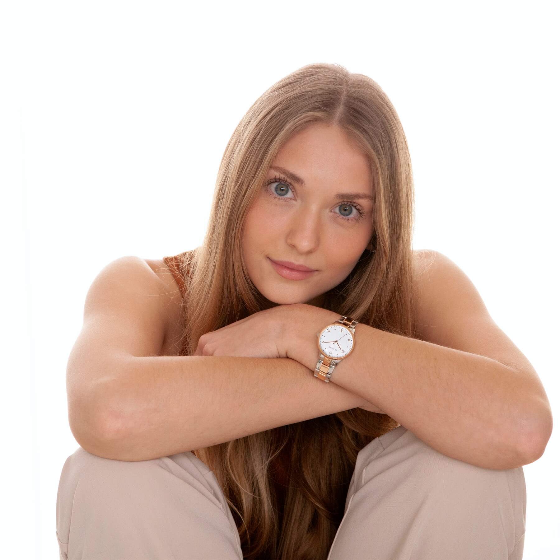 VEJRHØJ's Petite Royal Rose with white dial and rose gold case looking elegant in a woman's studio wear.
