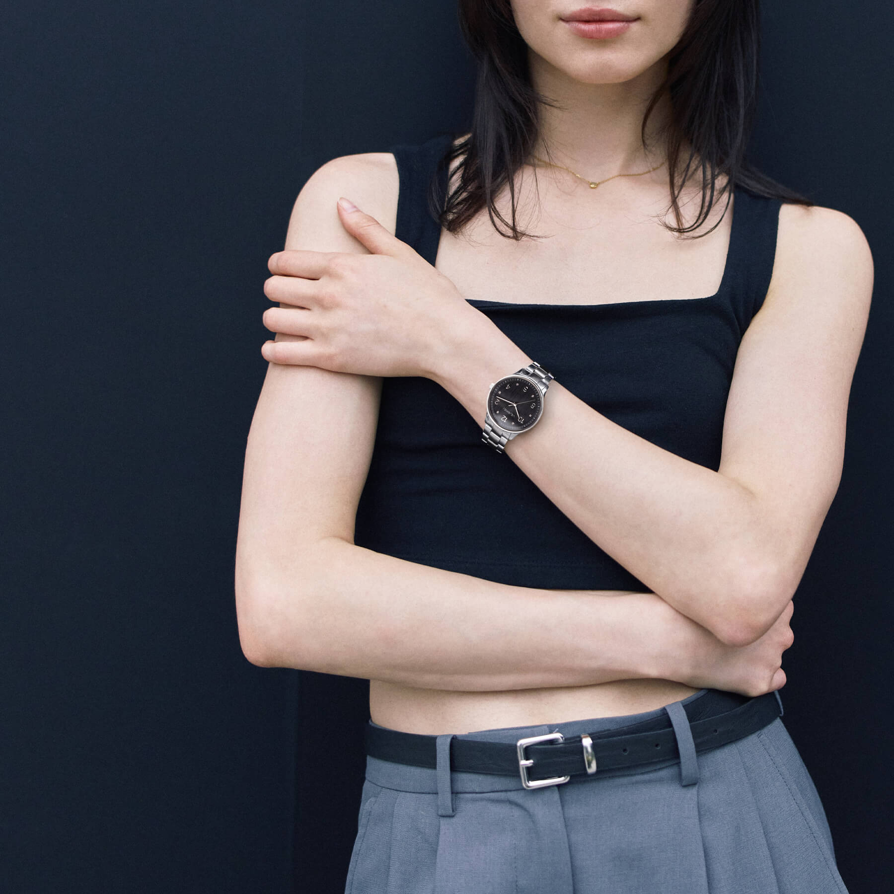 VEJRHØJ Petite Royal Black, a striking watch with a wooden dial and sparkling stone indexes and silver bracelet